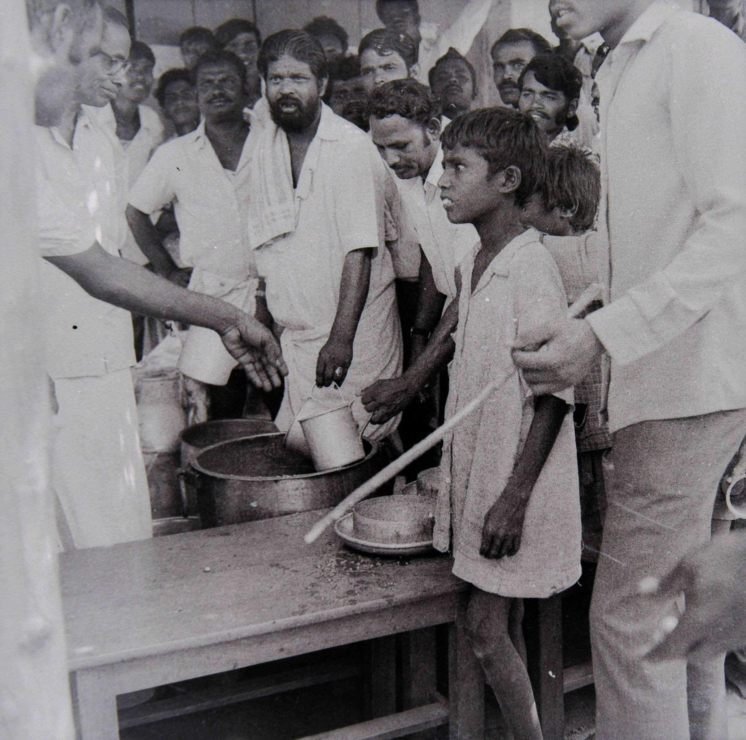 K.S. Seetharaman. Starving striking miners given a hot meal. 1978